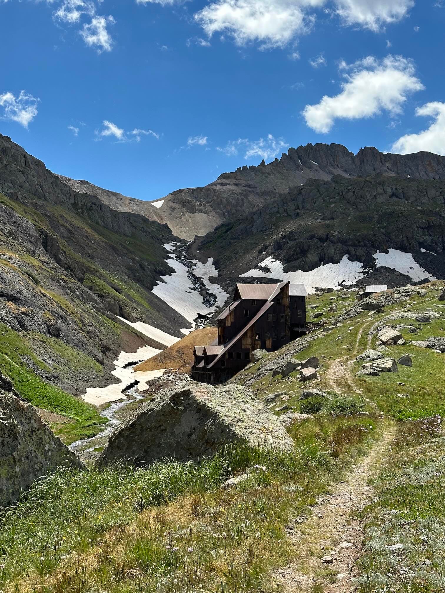 Lewis Mill, just below Lewis Lake. You can see Columbine Pass in the background — it’s the low spot just above the triangle of snow.