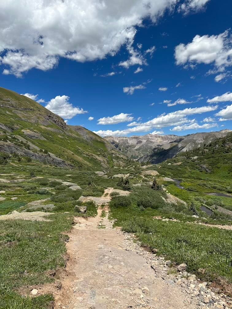 Looking back at some double track trail on the way up to Lewis Basin.