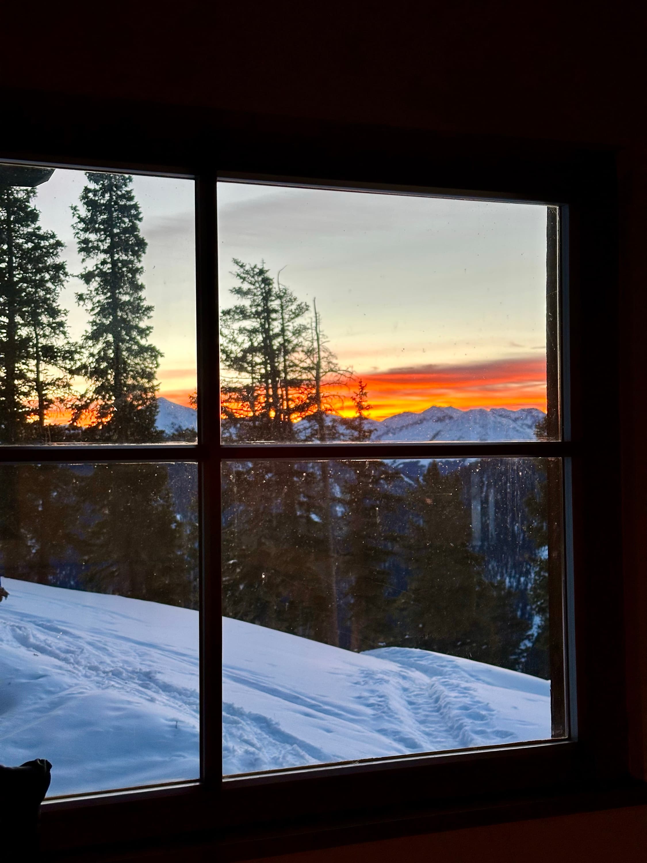 Winter sunset through a hut window