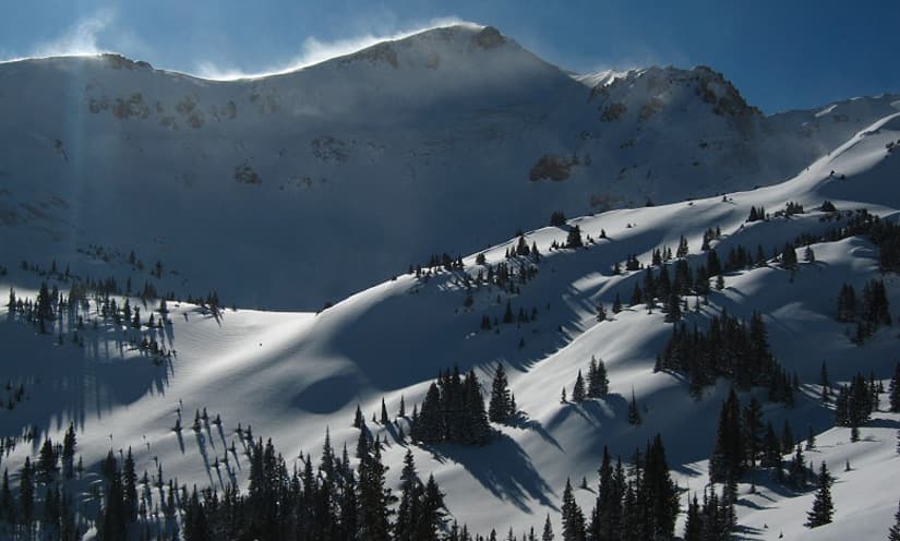 Wind-blown snow on the peaks above the hut